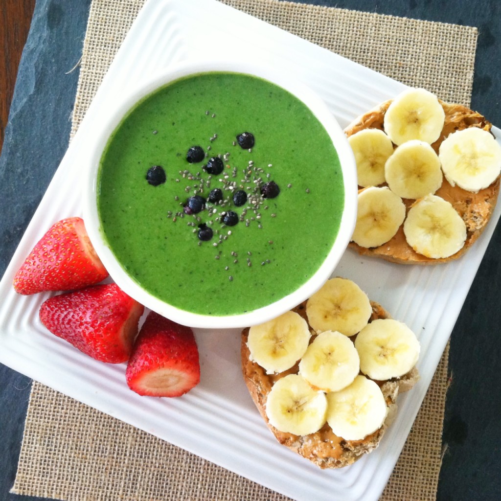 green smoothie bowl and fruit and english muffin