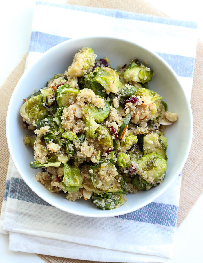 Maple Roasted Brussel Sprouts with Quinoa, Dried Cranberries, and Slivered Almonds. It's vegan, gluten free, and a perfect Thanksgiving side dish!